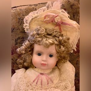 Porcelain DOLL by Mann.   Handmade. Approximately 25” tall